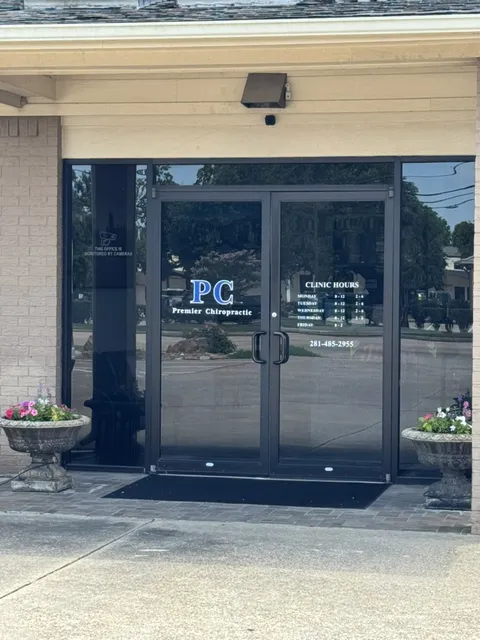 Glass double-door entrance with the Premier Chiropractic logo at the Old Town office.